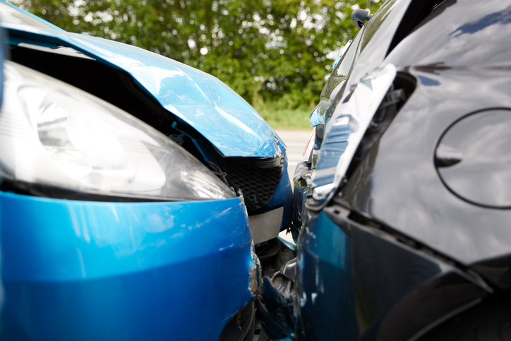 Close up of two cars damaged in road traffic accident - What not to do after a car accident